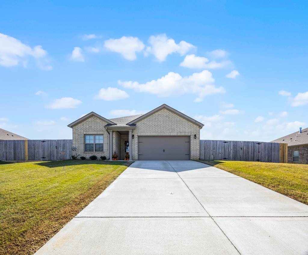 a view of a house with a swimming pool and a yard