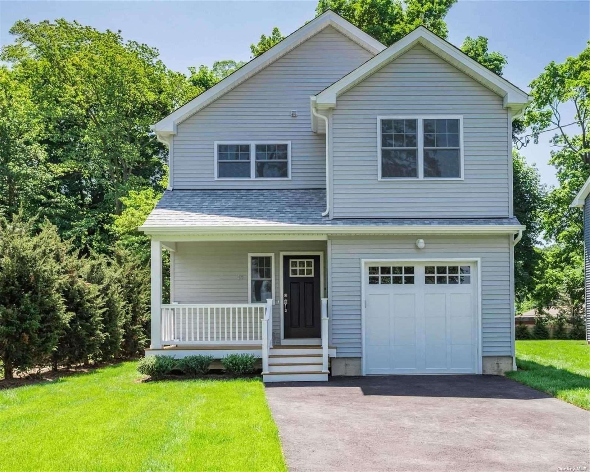 a view of front of house with a yard