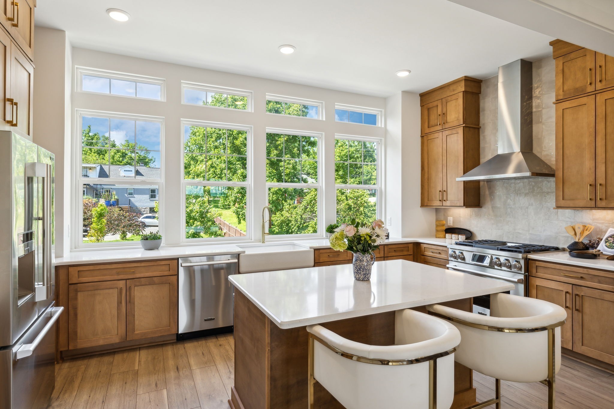 a kitchen with a stove a sink and a refrigerator