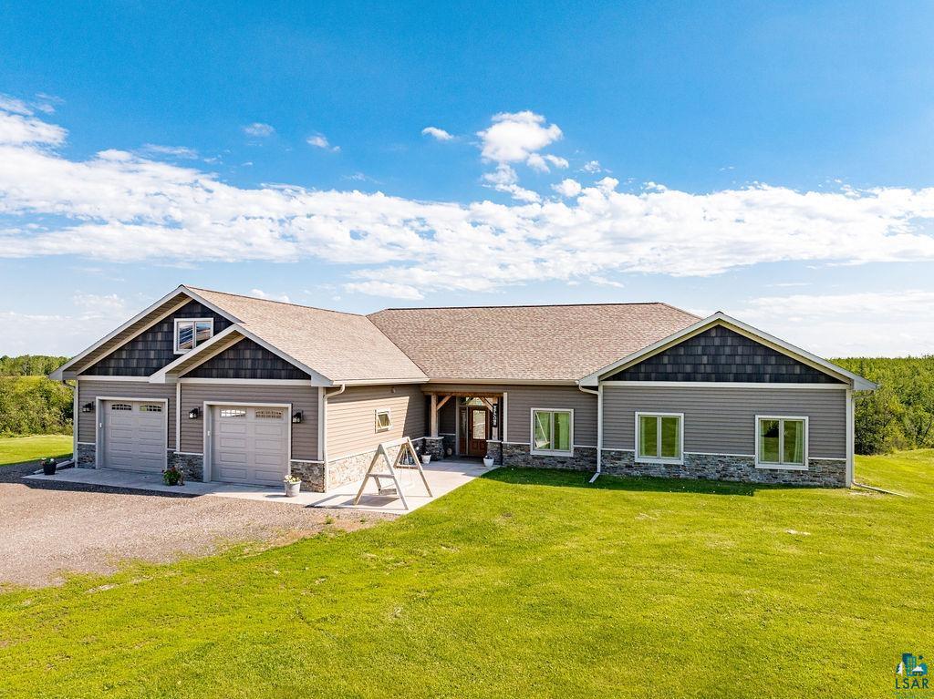 View of front of property with a front lawn