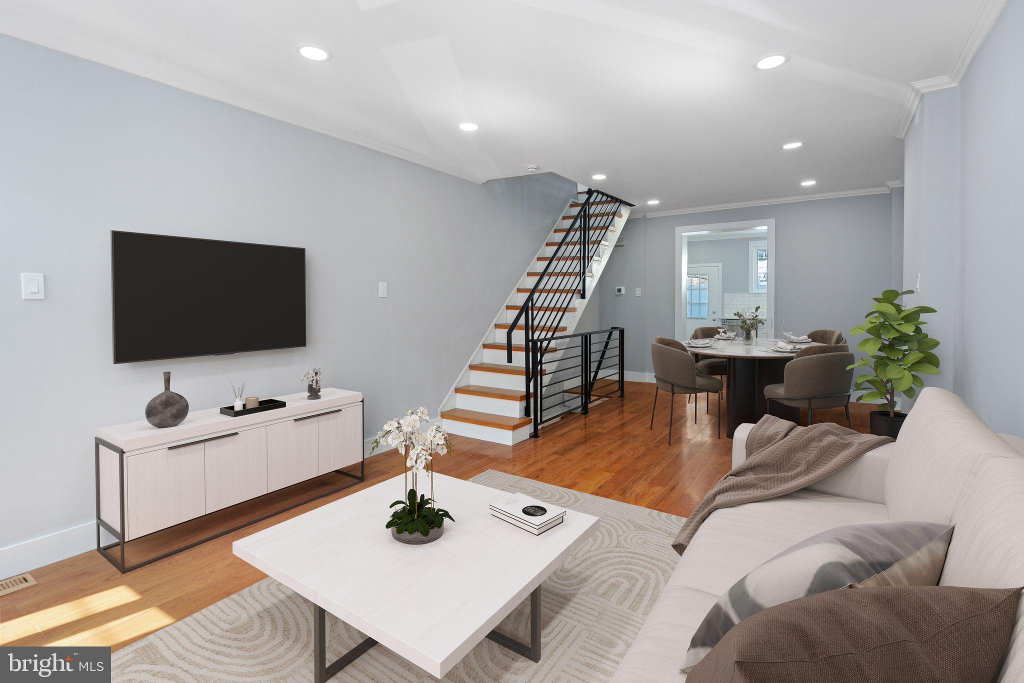 a living room with furniture and a flat screen tv