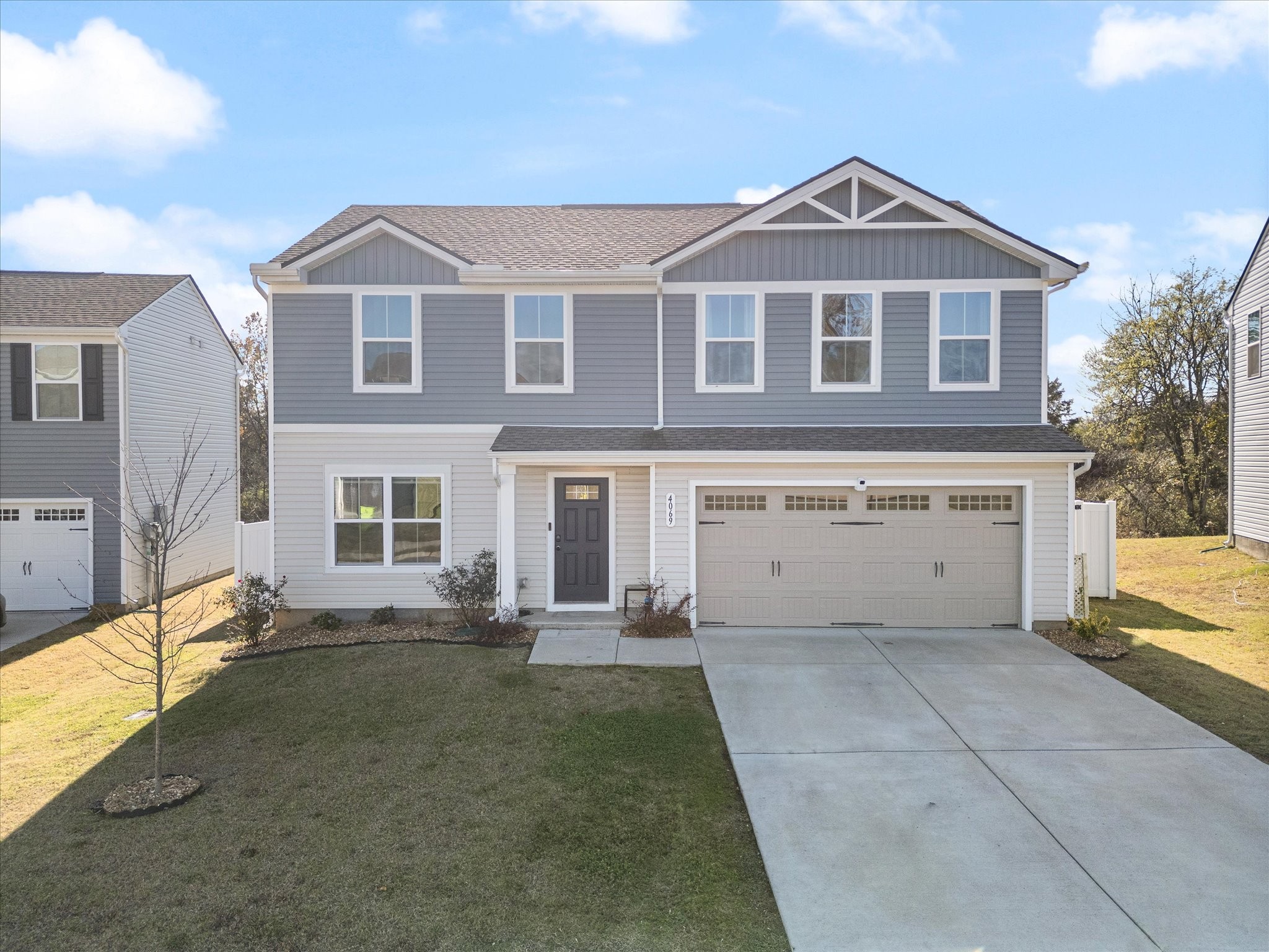 a front view of a house with a yard