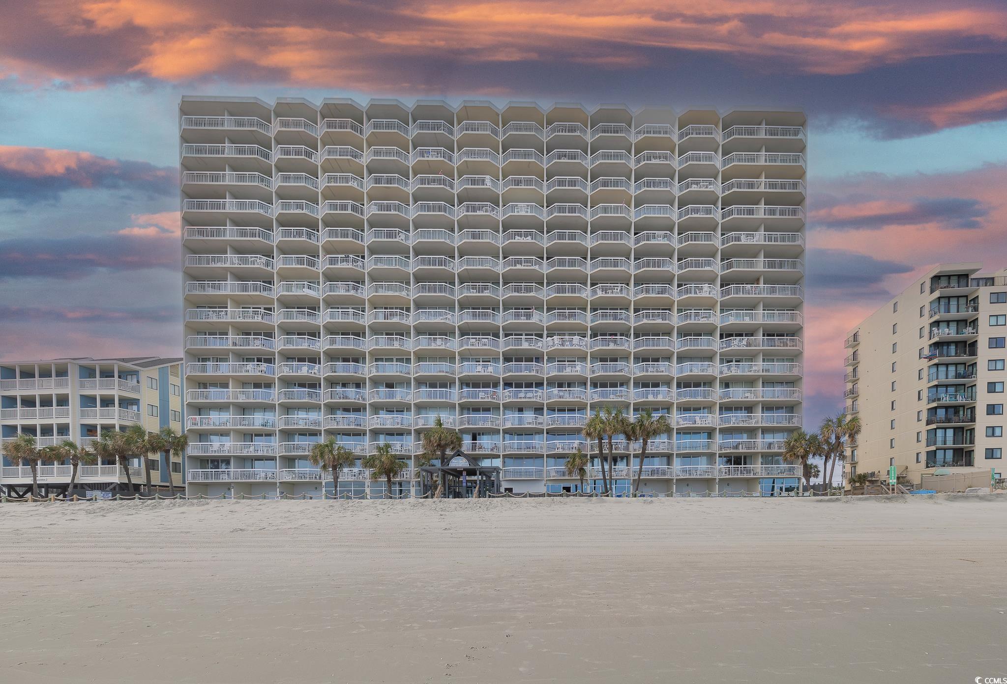 Outdoor building at dusk featuring a water view