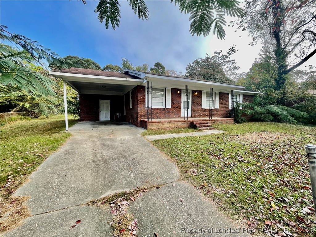 front view of a house with a yard