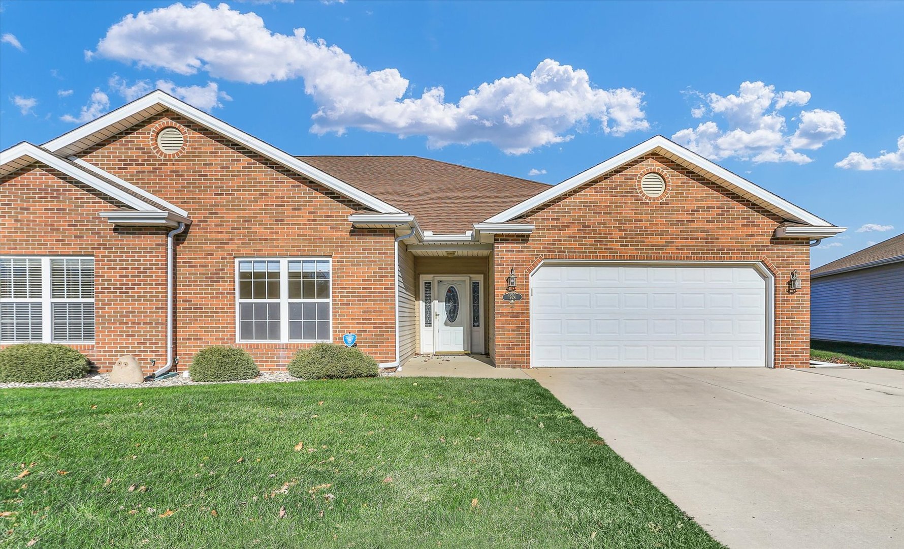 front view of a house with a yard