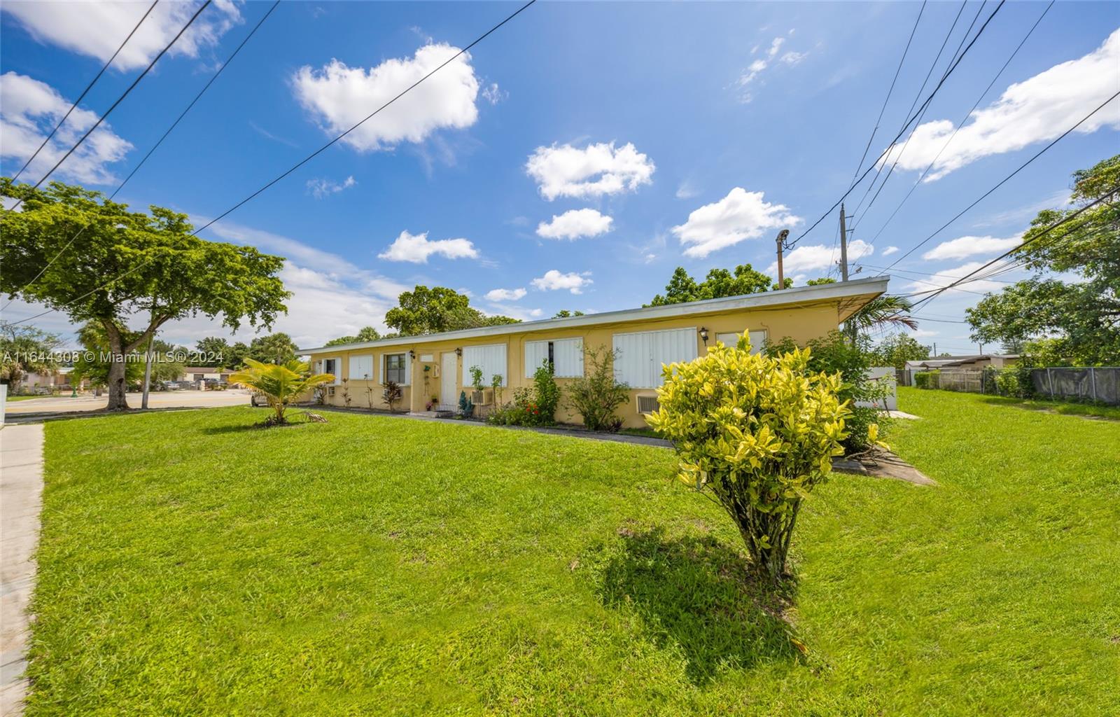 a view of a big yard with a house