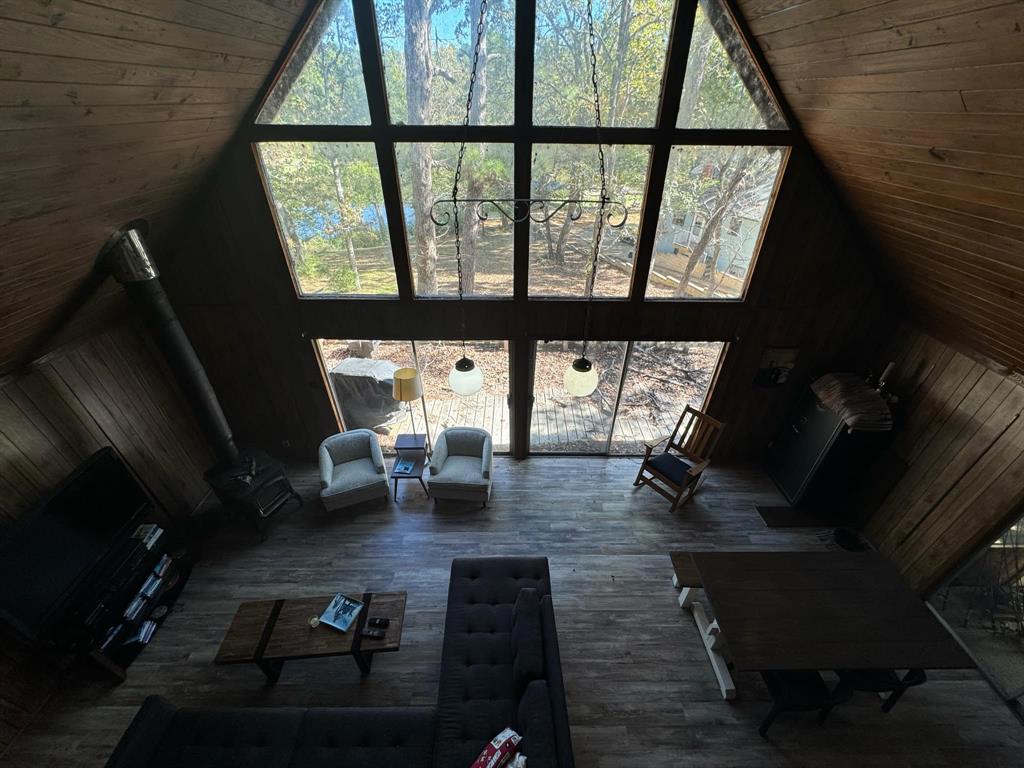 a living room with furniture window and wooden floor