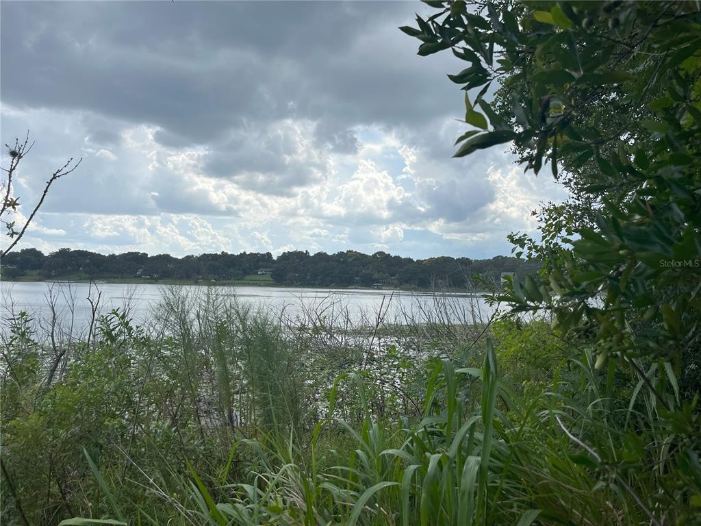 a view of lake with mountain in the back