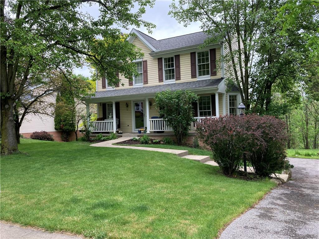 a house view with swimming pool and garden