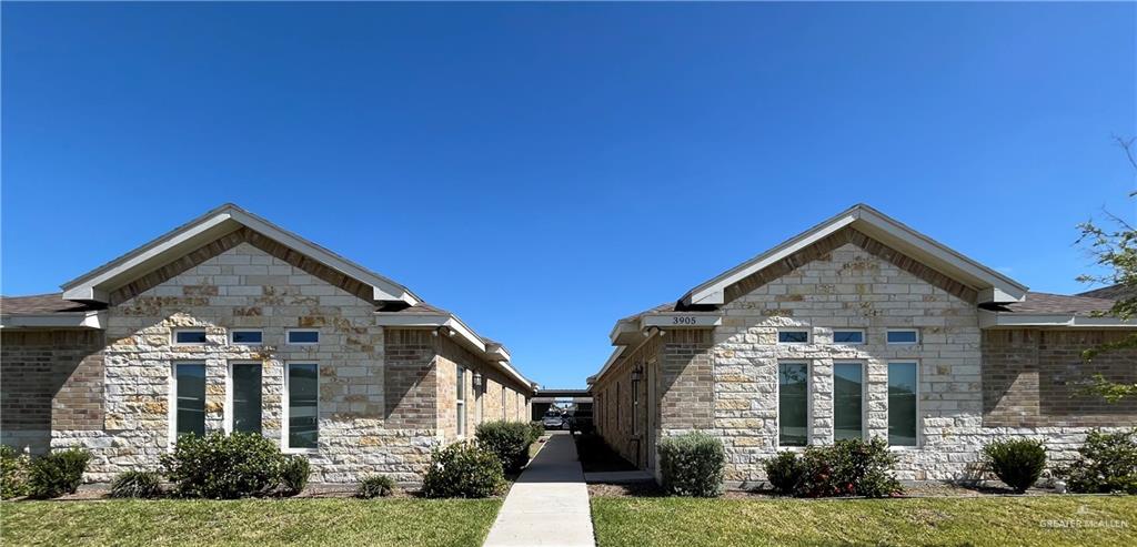 front view of a house with a yard