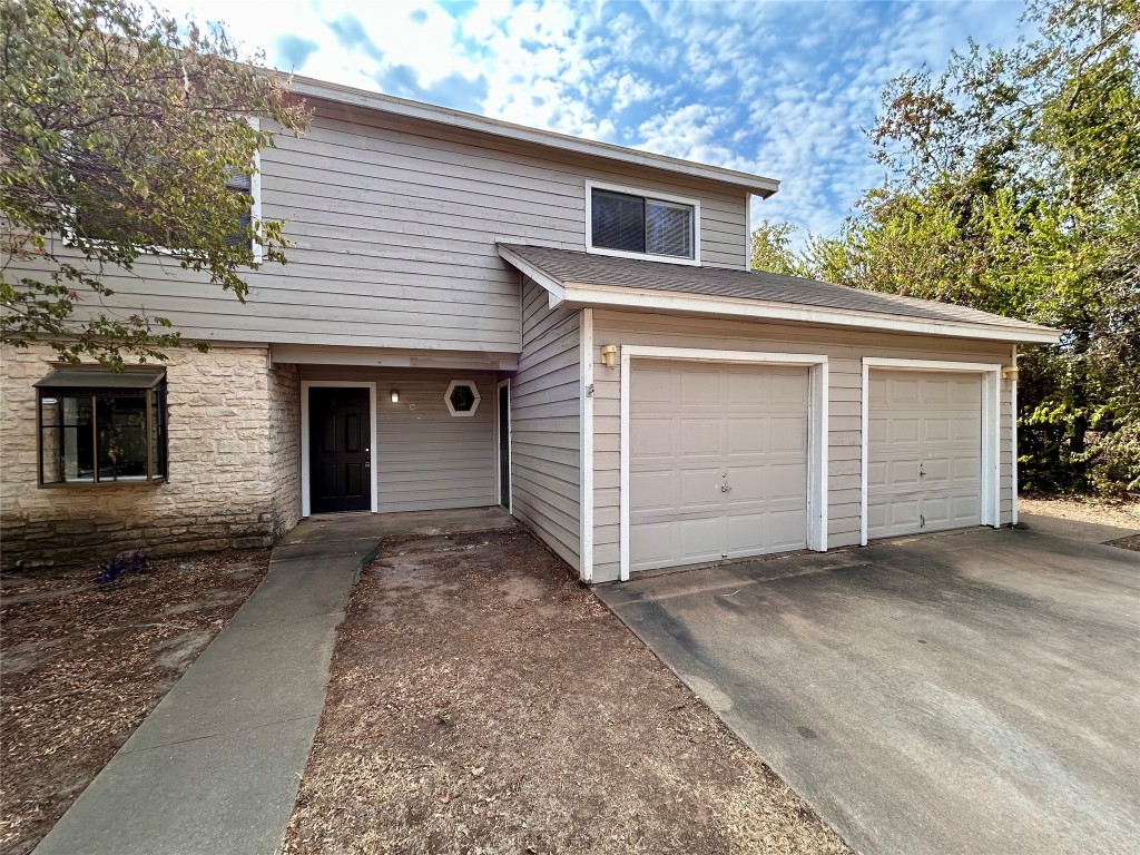 a view of a house with a garage