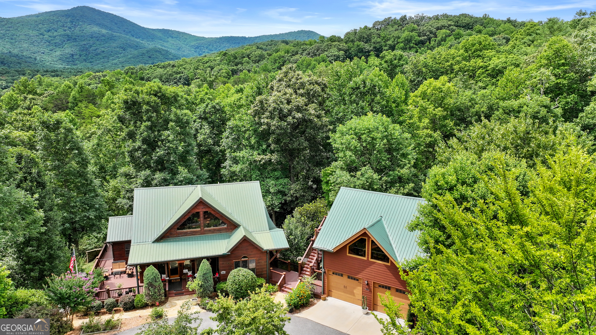 an aerial view of a house with yard and outdoor space