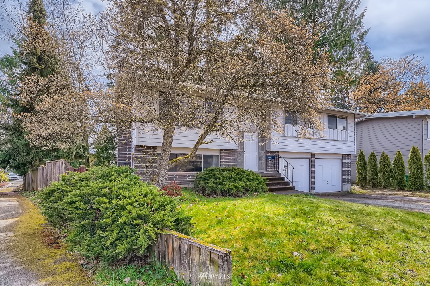 front view of a house with a yard