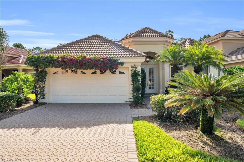 Mediterranean / spanish house featuring a garage