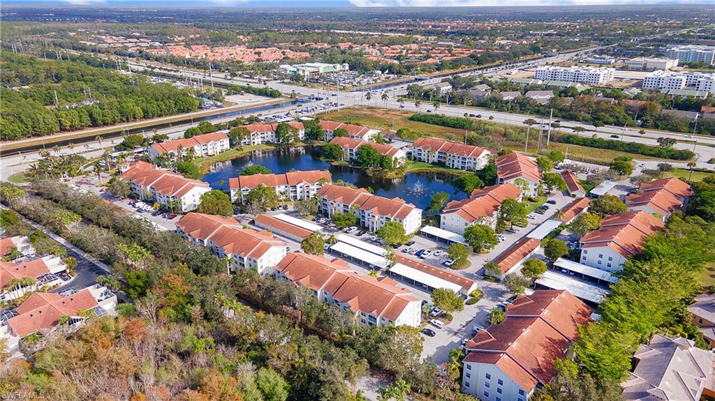 an aerial view of a city with a lake