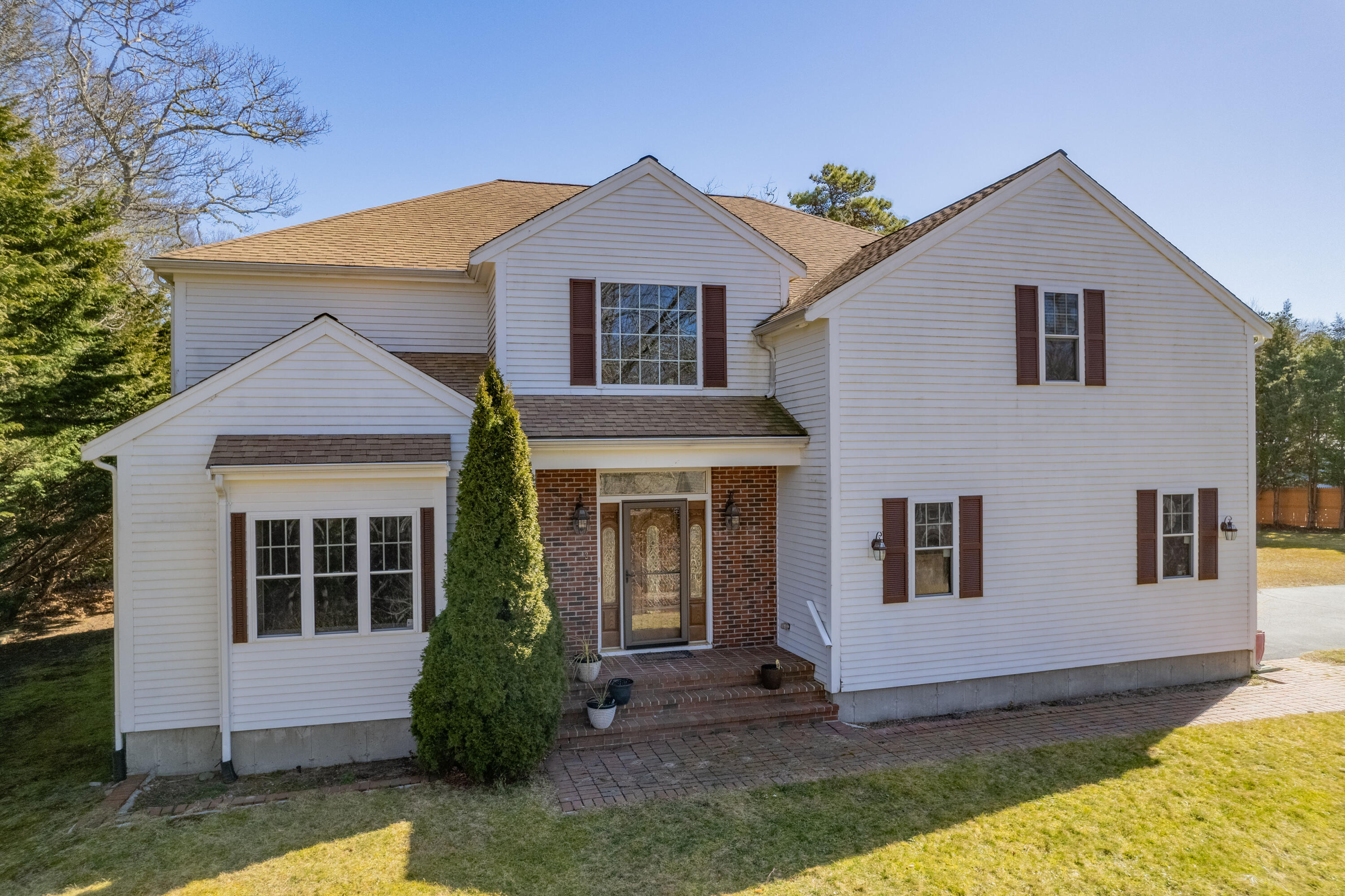 a view of a yard in front of a house