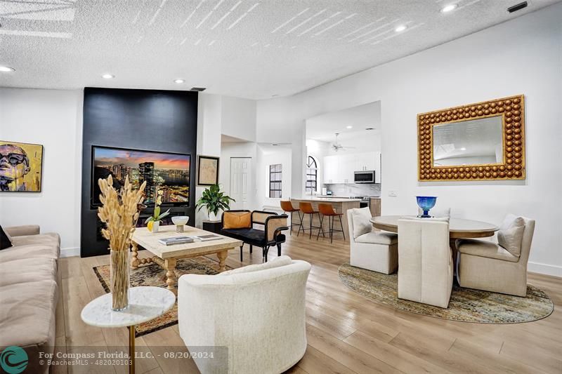 a living room with fireplace furniture and a flat screen tv