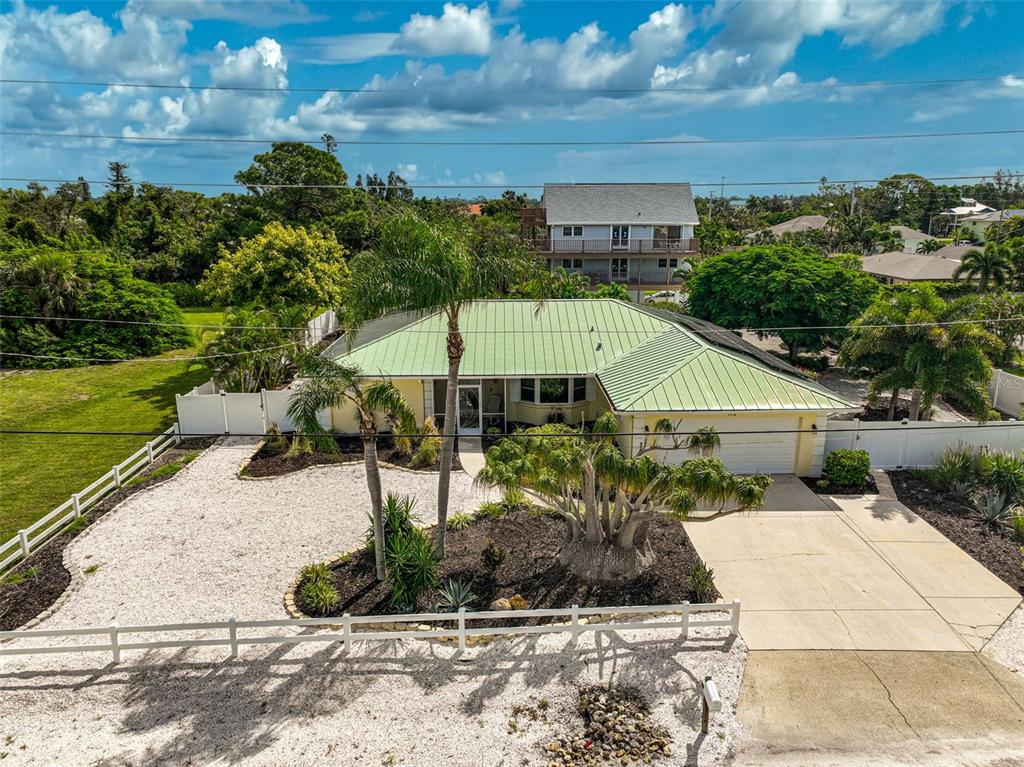 a aerial view of a house with a yard