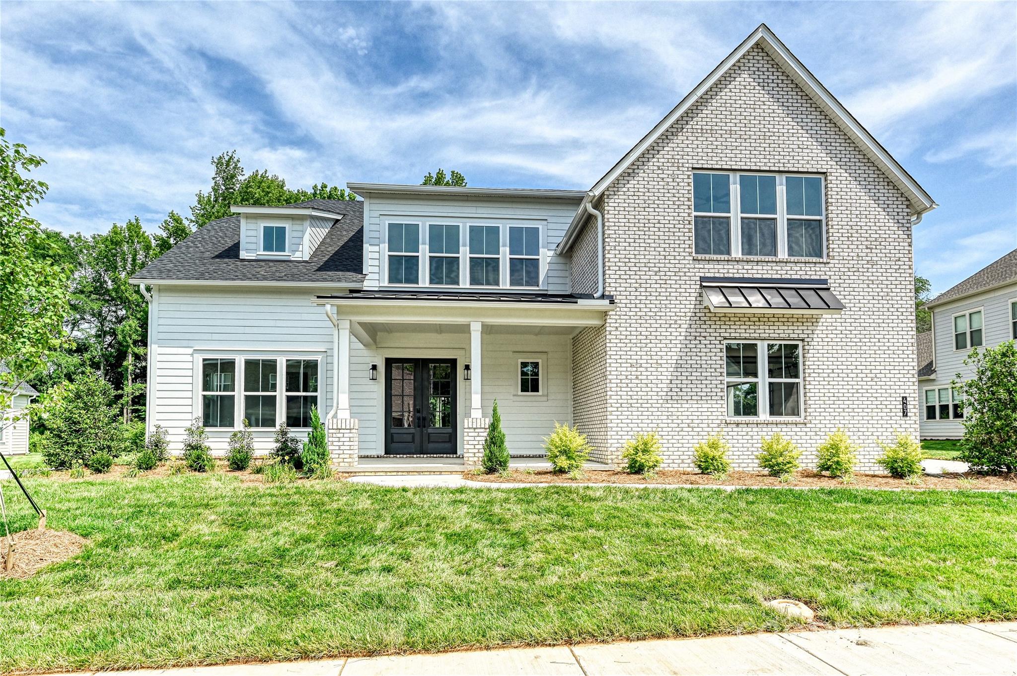 front view of a house with a yard