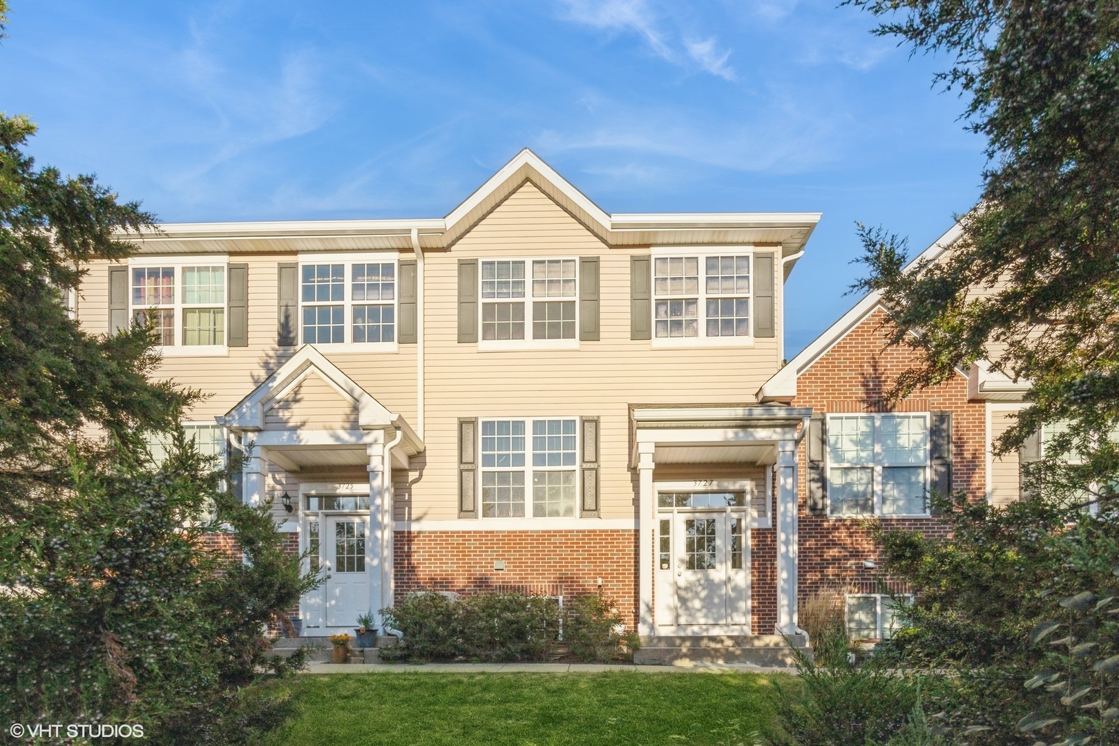 a front view of a house with a yard