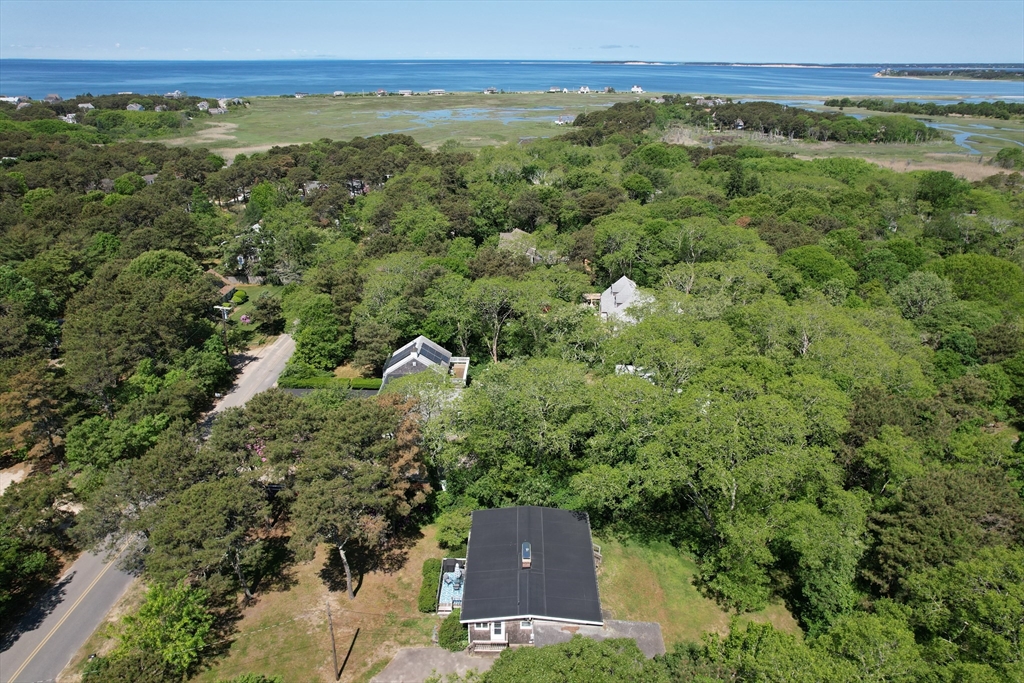 an aerial view of a house with a yard