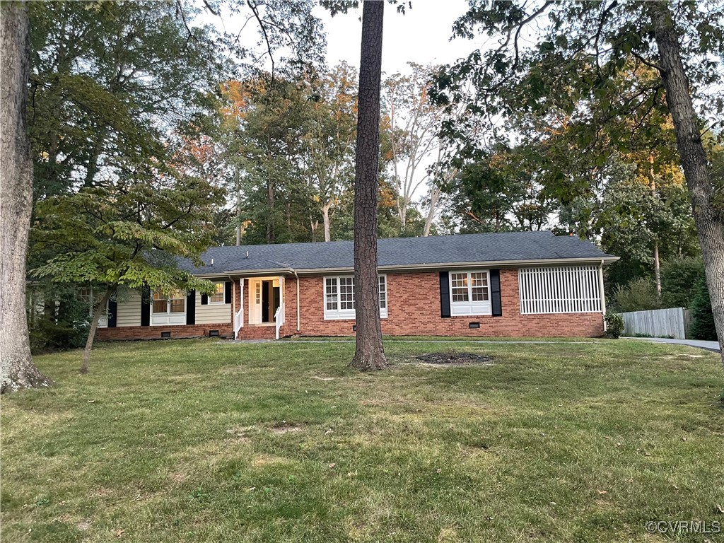 a house that has a tree in front of it