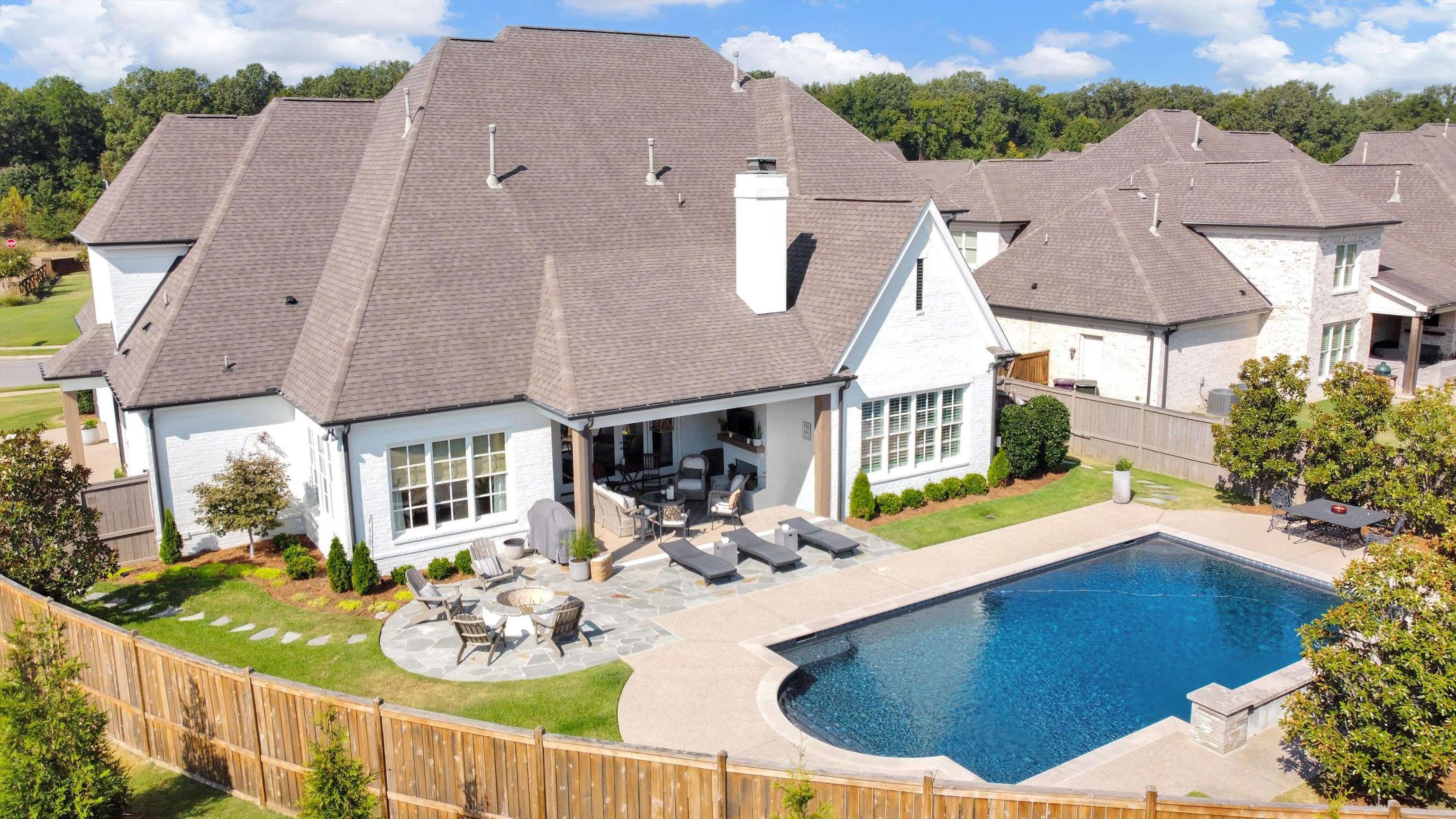 an aerial view of a house with outdoor space