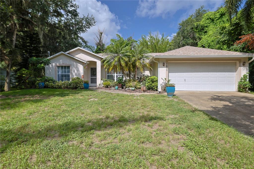 a front view of house with yard and green space