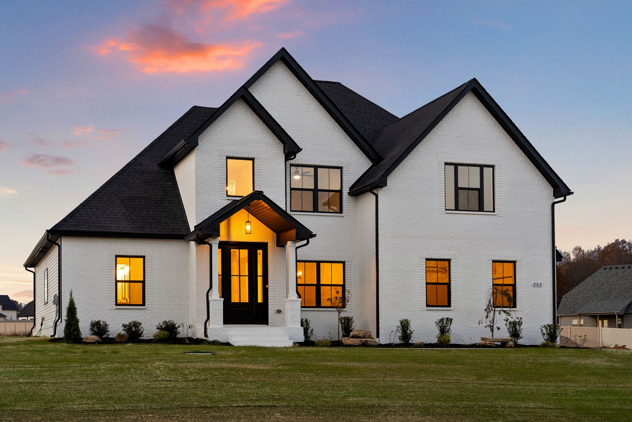 a front view of a house with a yard