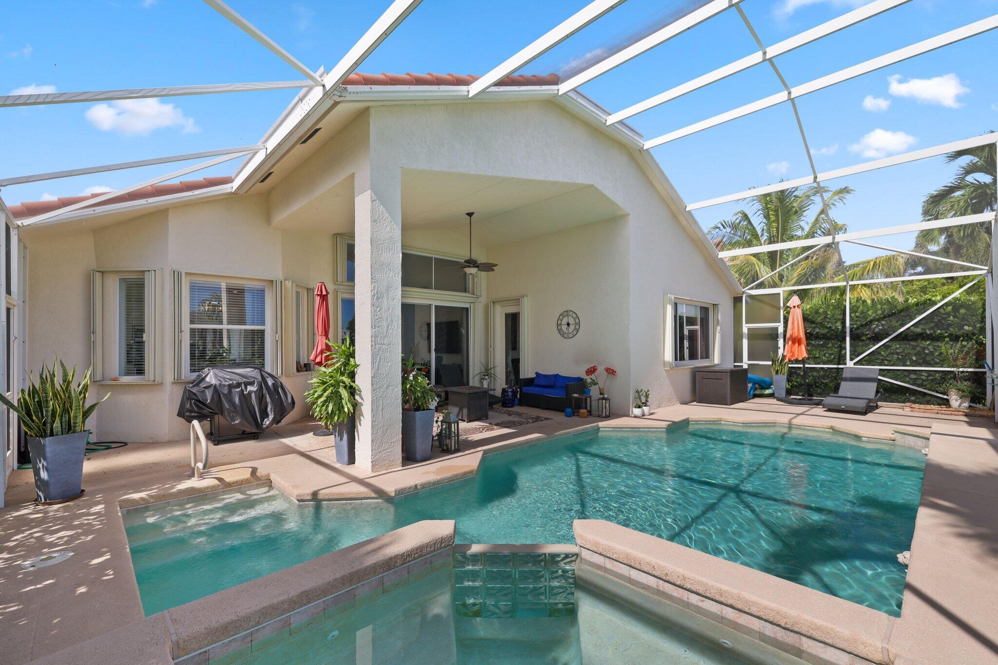 a view of an house with backyard porch and outdoor kitchen