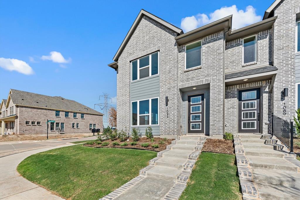 a view of a house with a yard porch and sitting area