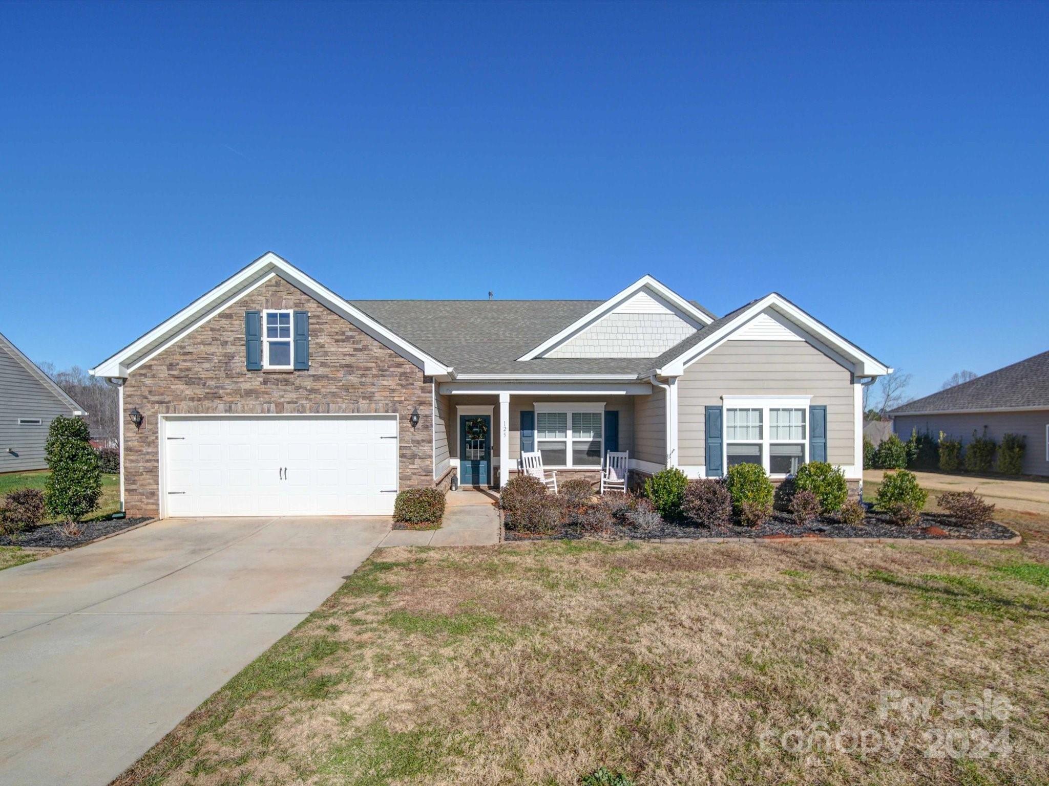 a front view of a house with yard