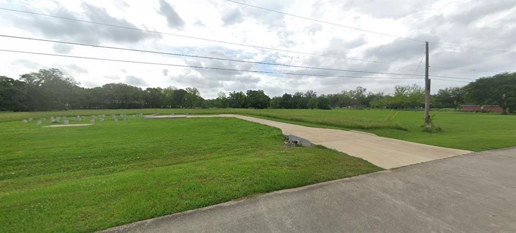 a view of a golf course with a lake