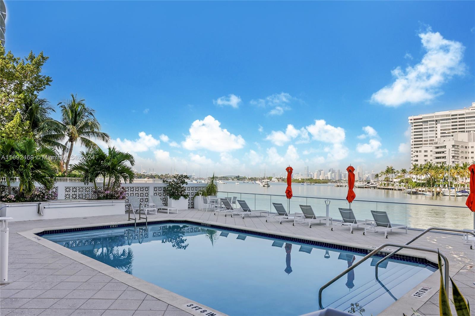 a view of a swimming pool with outdoor seating