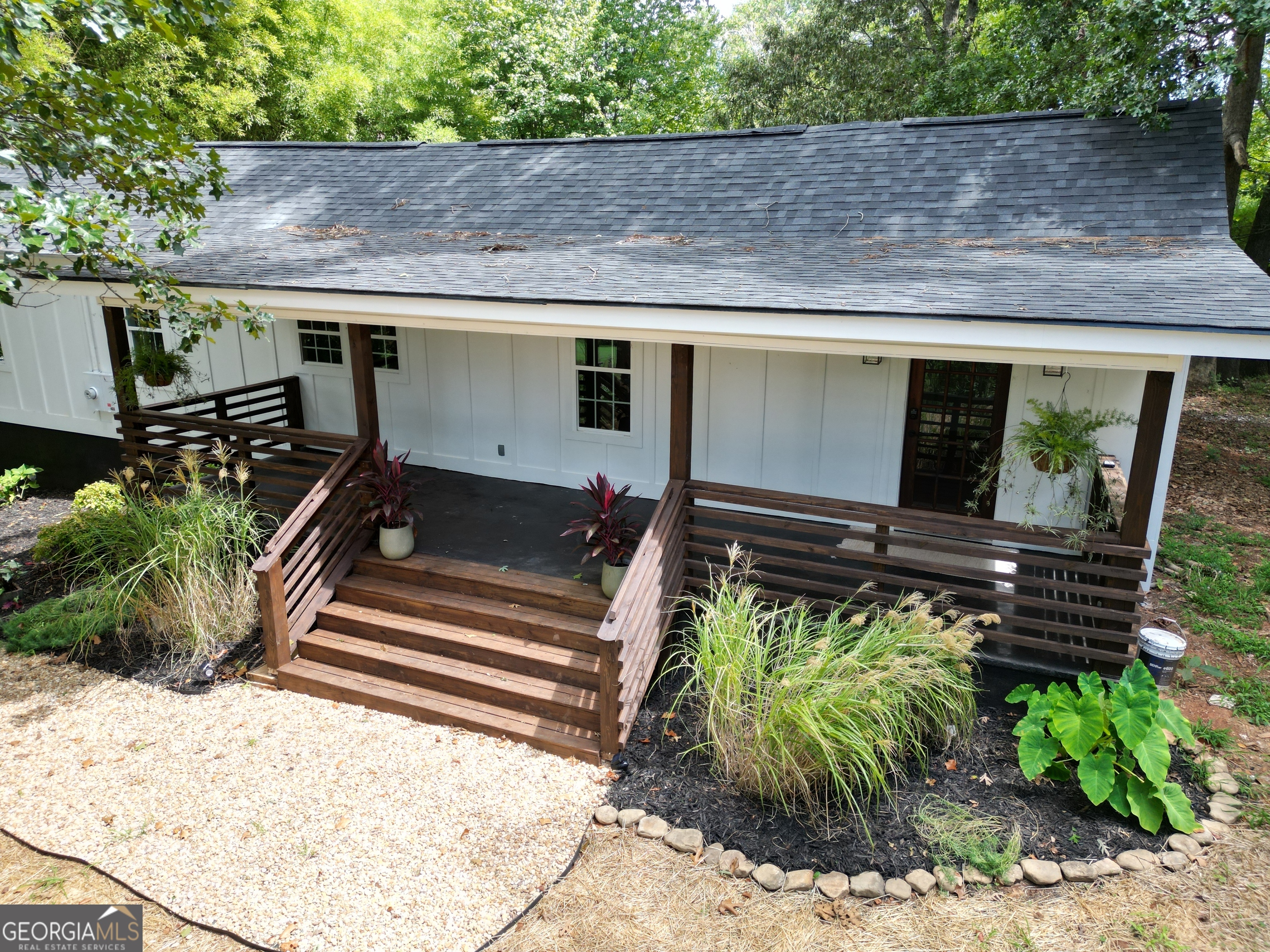 a front view of a house with garden