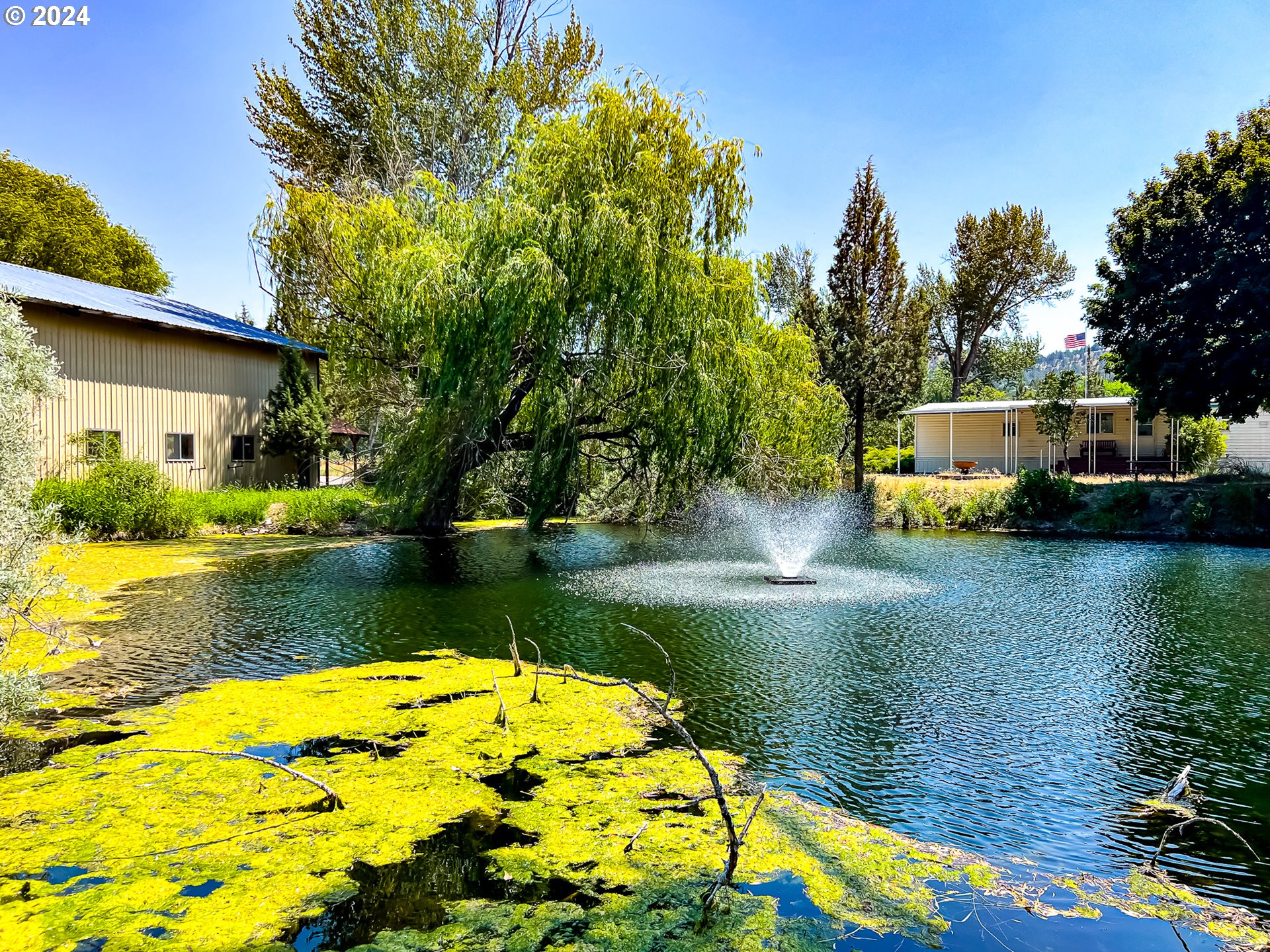 a view of a lake with a house in the background