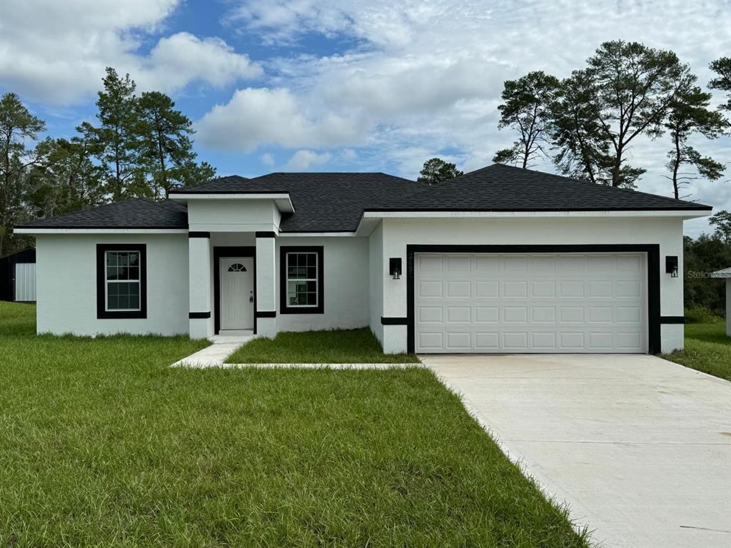 front view of a house with a yard