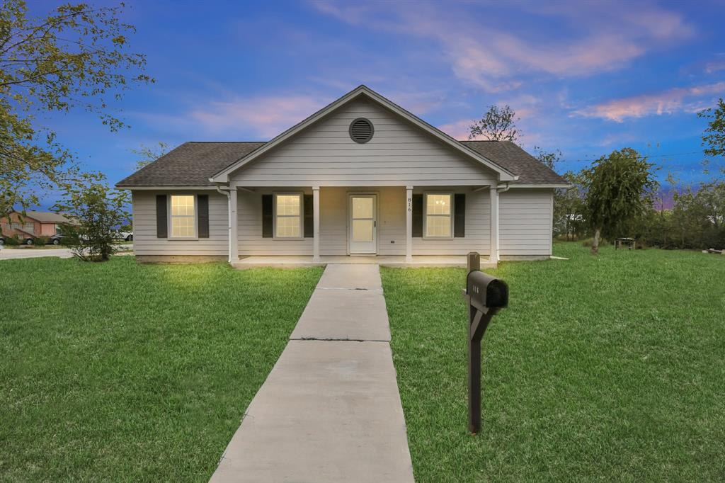 a front view of a house with yard