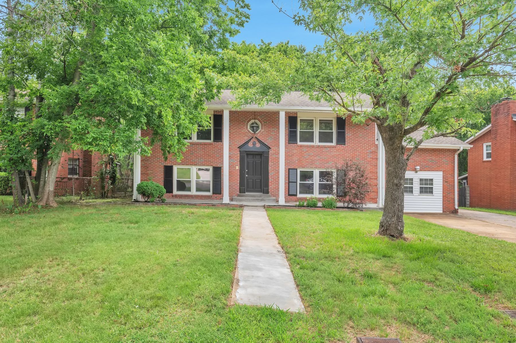 front view of a house with a yard