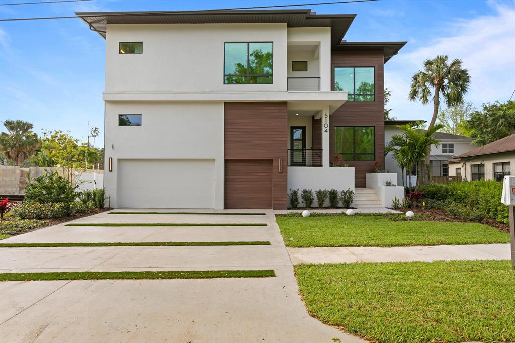 Welcome to this stunning contemporary masterpiece in the highly sought-after Beach Park neighborhood of South Tampa!