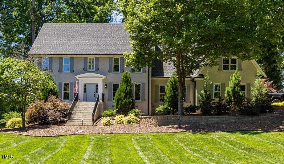 a front view of a house with garden