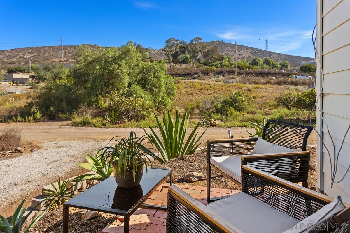 a view of a chairs and table on the terrace