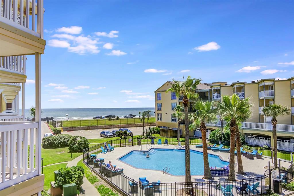 a view of a swimming pool with a patio