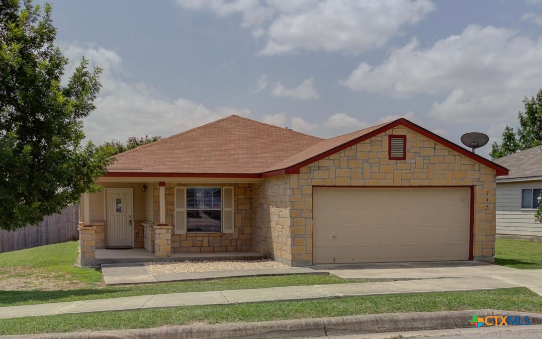 a front view of a house with a yard