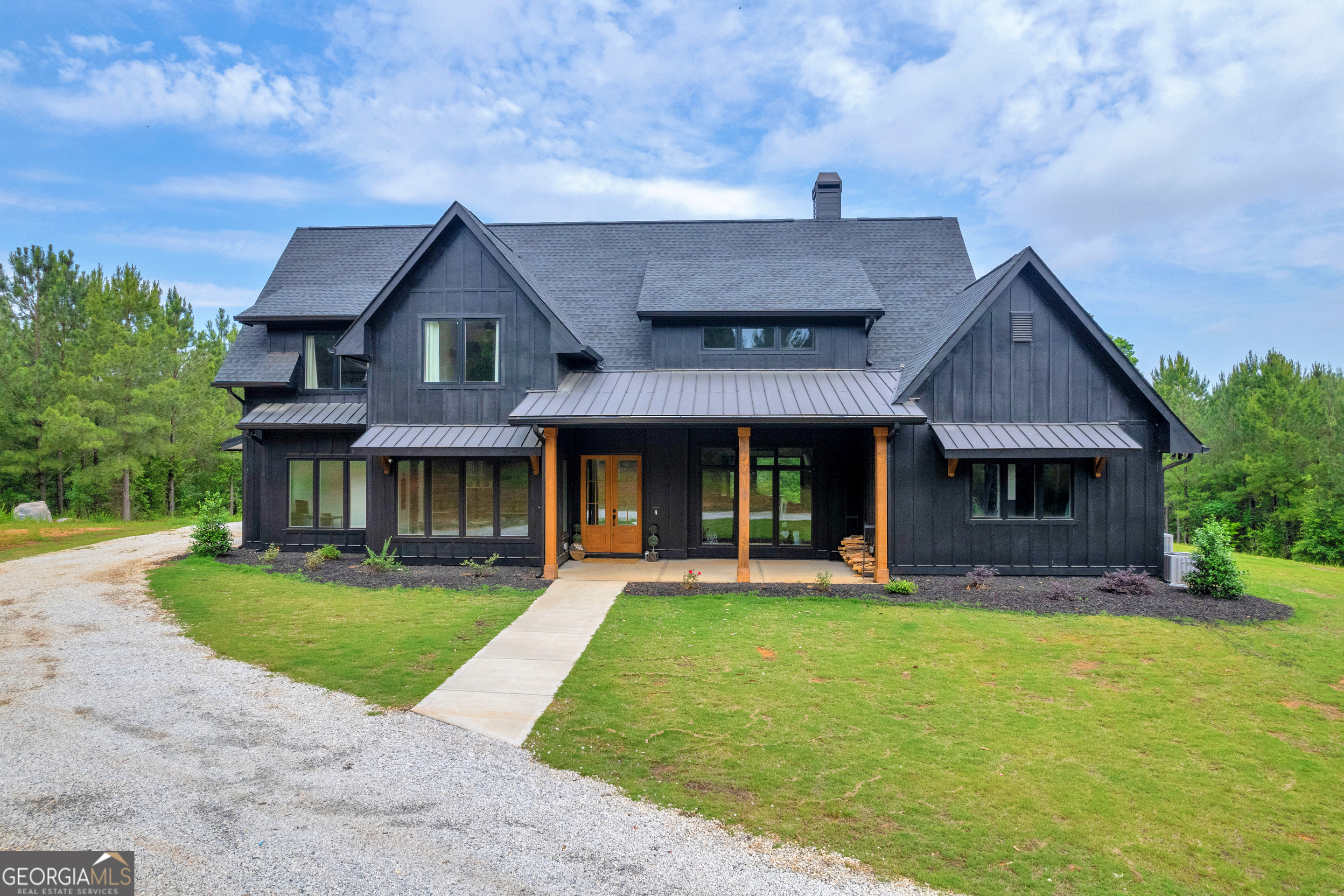 front view of a house with a yard