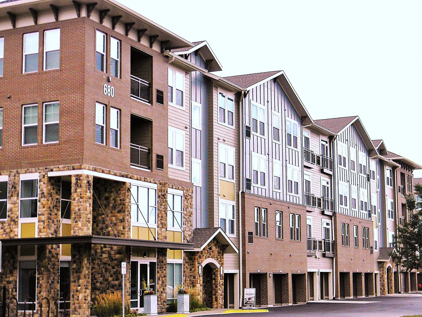 a front view of a building with a lot of windows