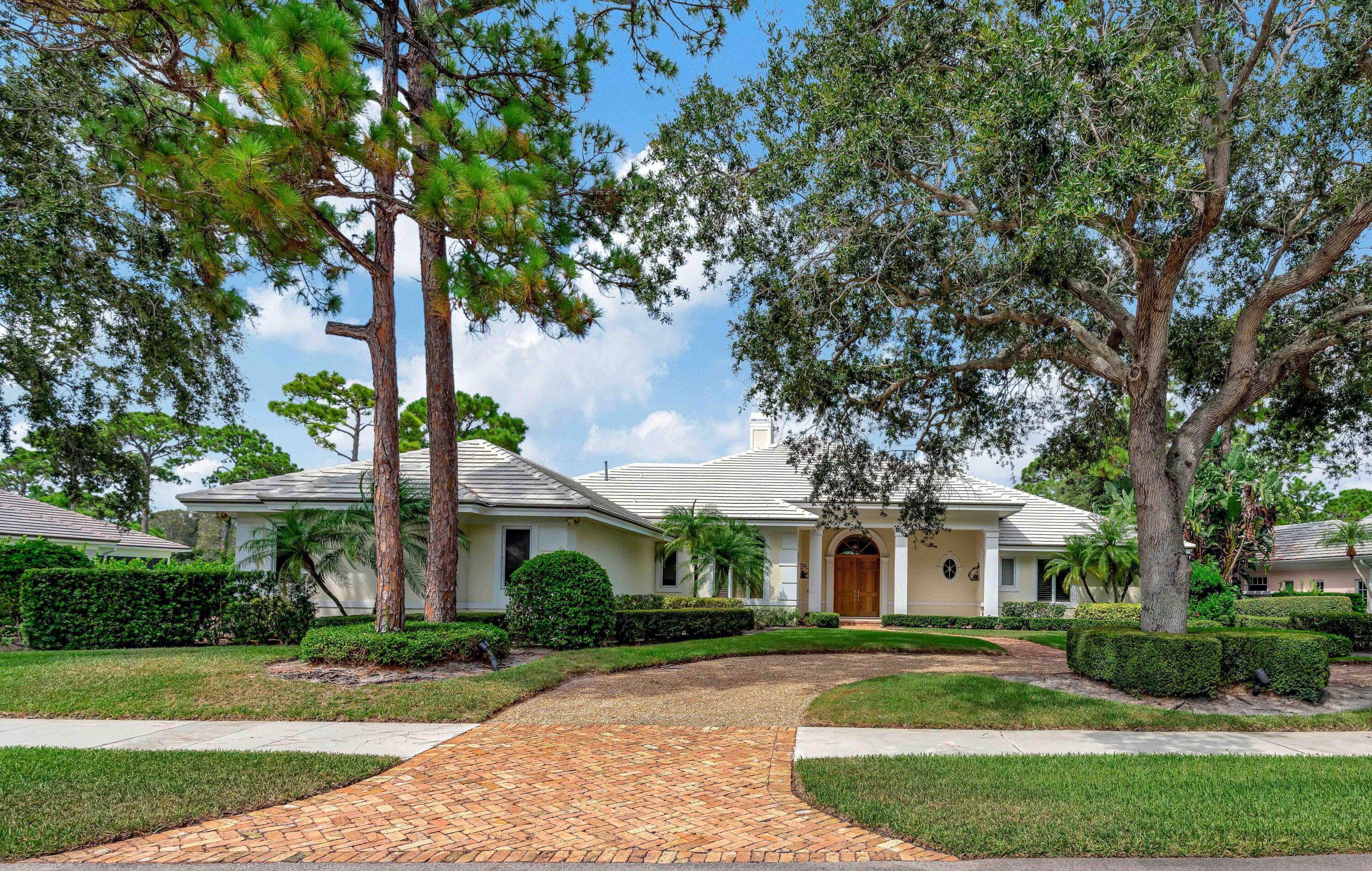 front view of a house with a garden