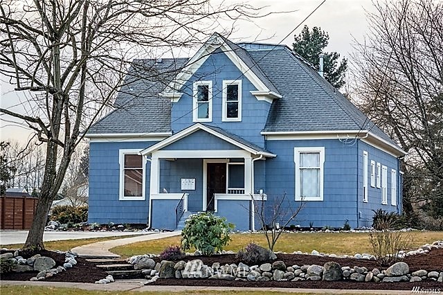 a front view of a house with a yard