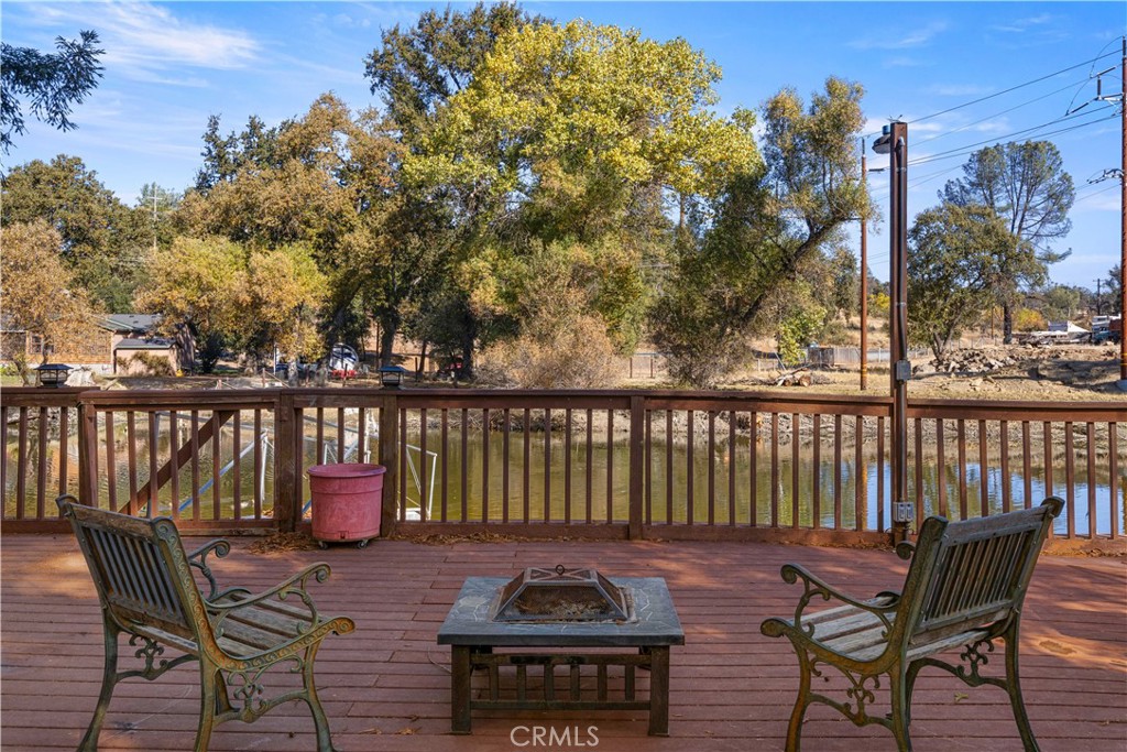 a view of a chairs and table on the deck