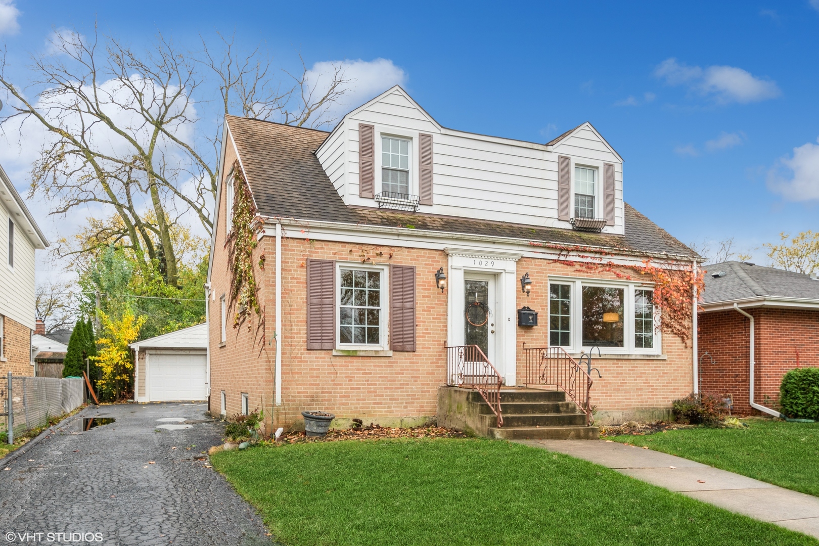 front view of a house with a yard